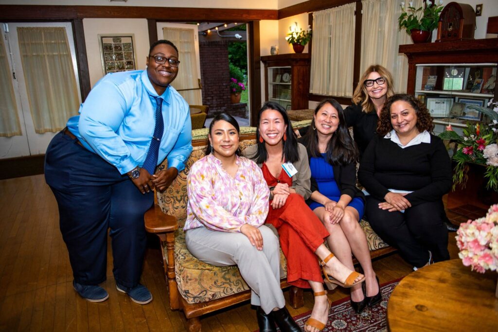 group of people sitting on a couch together